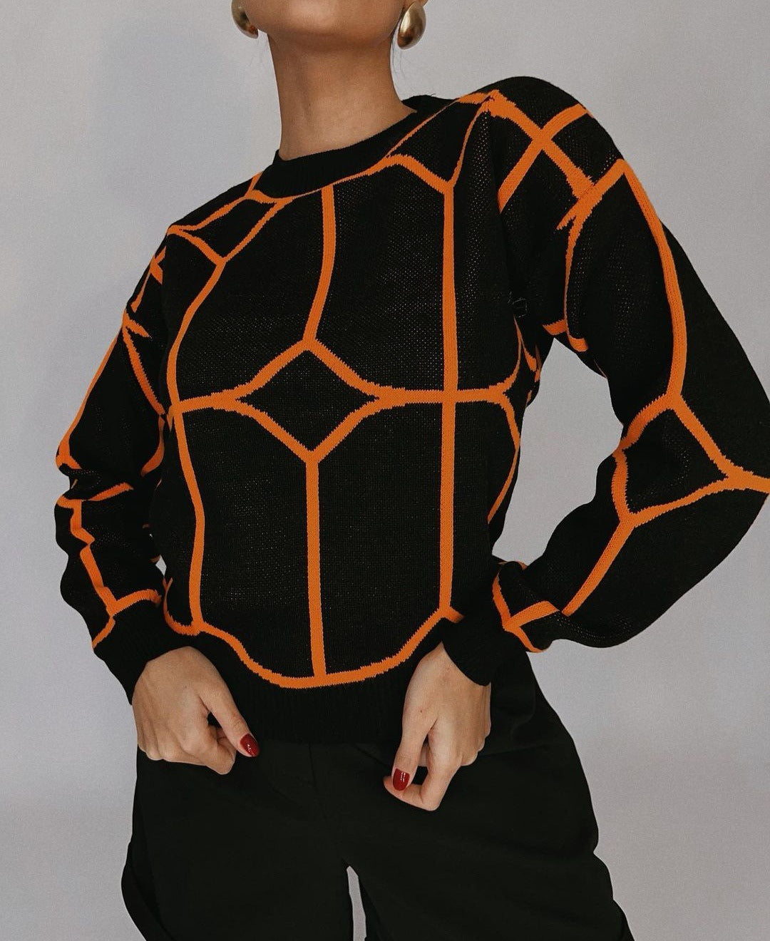 Blusa de malla de color geométrico