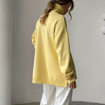 Blusa oversize de malla con cuello alto